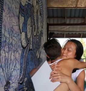 Yoga Teaching Students hugging